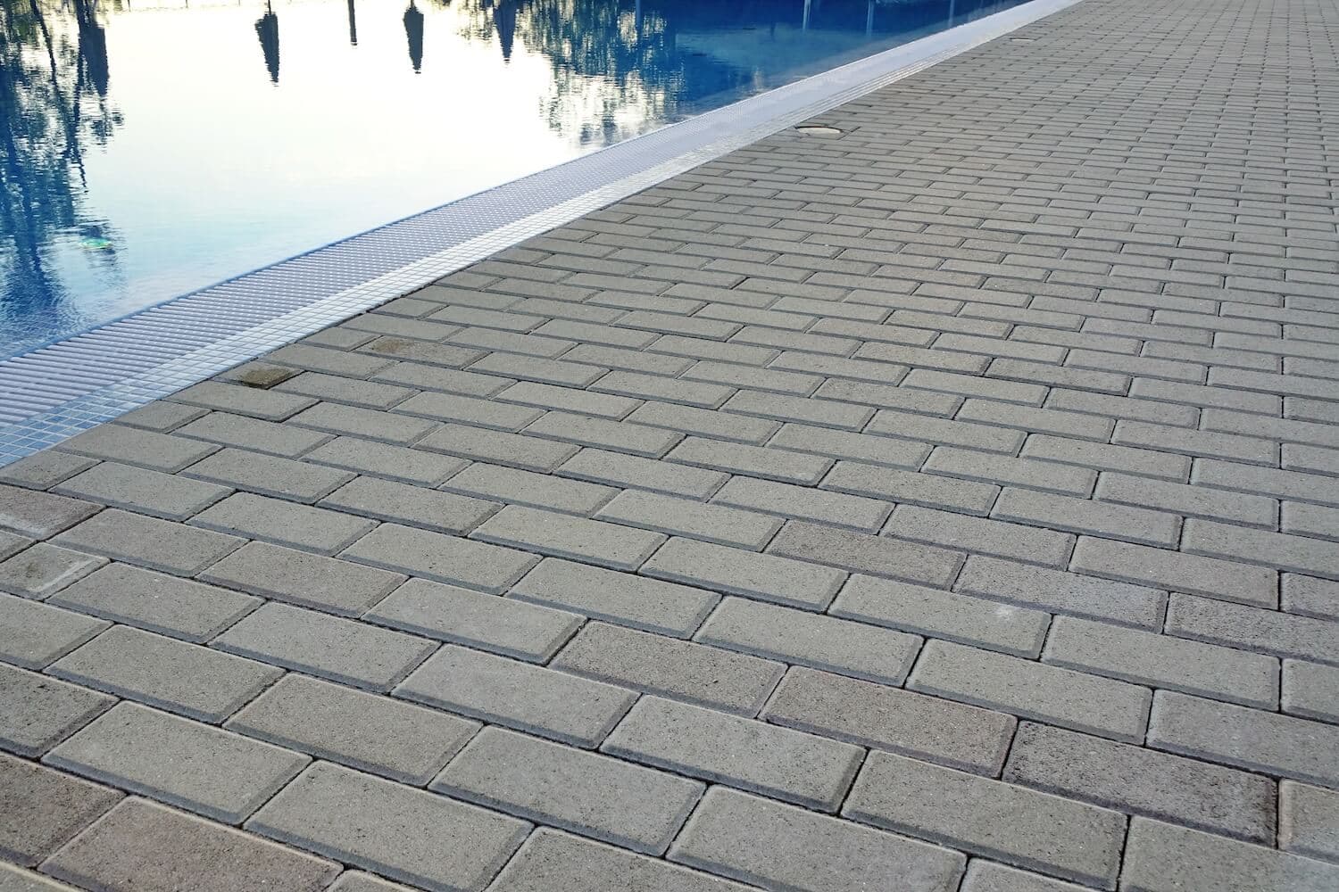 Slip-Free Summer: How Paver Installation Keeps Your Pool Deck Safe & Dry