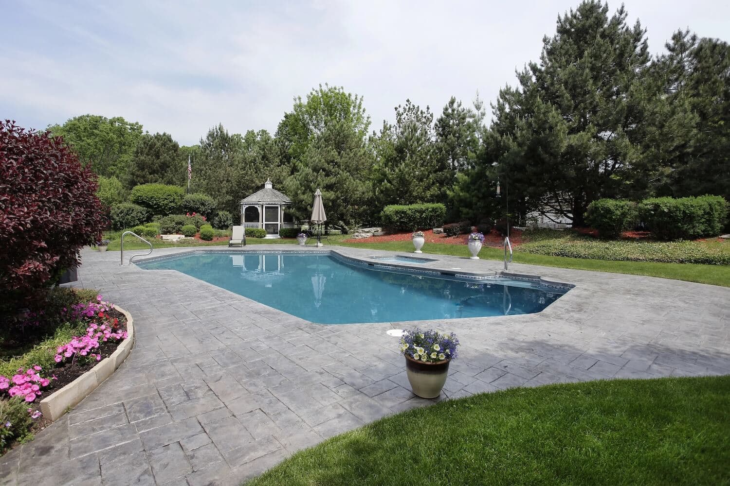 Tired of Your Slippery Wood Pool Deck? How Pavers Add Grip and Glamour